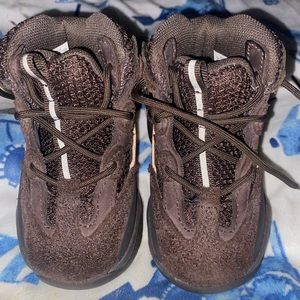 Yeezy Boots 5c Had on about 2/3 times comes with a box on stockx for 414.